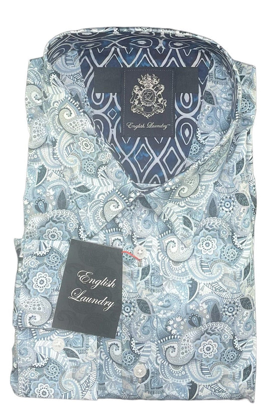 Folded shirt with paisley pattern and brand label on a white background